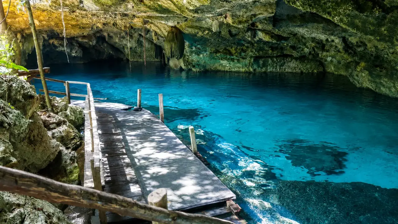 Cenote Dos Ojos clear blue water and wooden platform